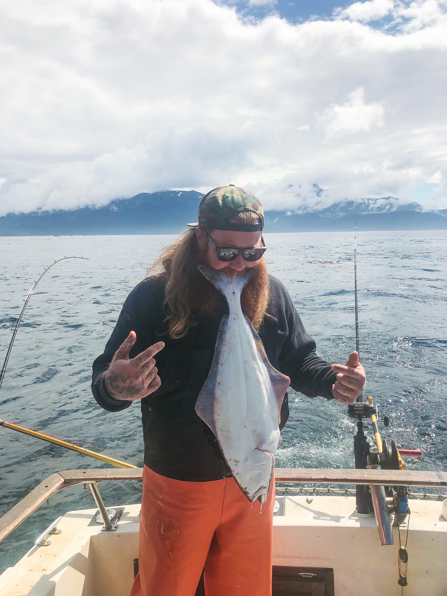 a person holding a fish in the water